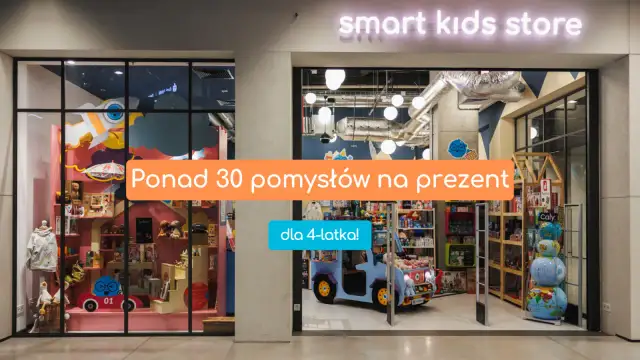Witryna sklepu z zabawkami "smart kids store" z pomarańczowym napisem "Ponad 30 pomysłów na prezent" i niebieskim "dla 4-latka!".