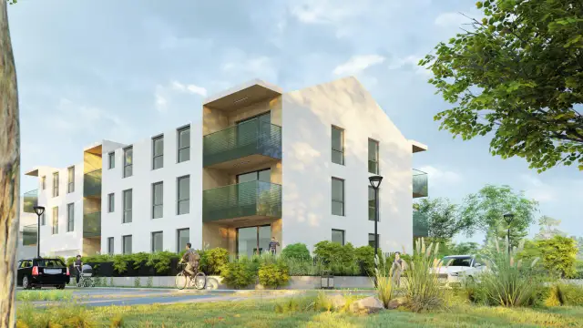 Nowoczesny budynek mieszkalny z balkonami, idealny pod leasing na nieruchomość. Obok samochody, rowerzysta i spacerowicze.