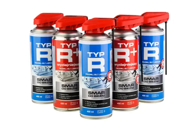 Pięć puszek smaru do bieżni z czerwonymi aplikatorami na białym tle.
