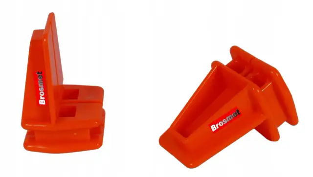 Pomarańczowe narożniki do układania cegieł, niezbędne narzędzia murarskie.