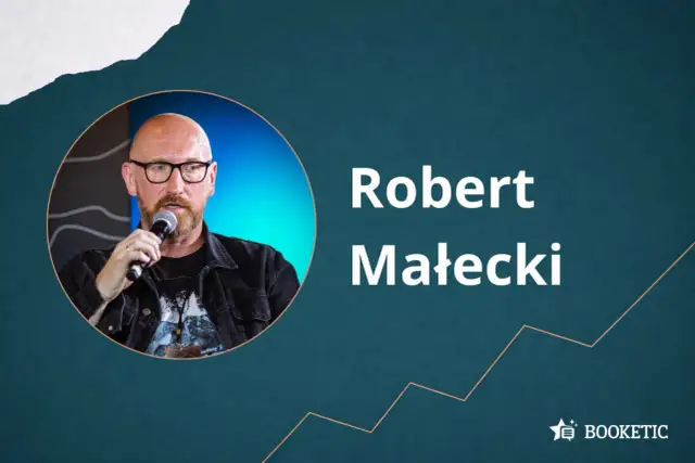 Robert Małecki, autor wielu inspirujących książek, przemawia na tle grafiki.