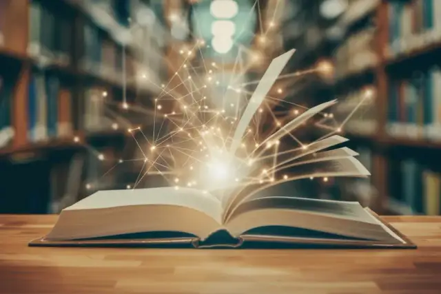 Otwarta księga z magicznymi światłami i siecią połączeń na tle biblioteki.