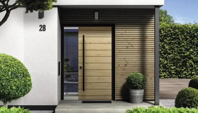 Drzwi metalowe czy drewniane do domu - co wybrać dla bezpieczeństwa?