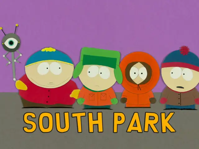 Czterech chłopców z South Park po polsku: Cartman, Kyle, Kenny i Stan, obok robota z okiem.