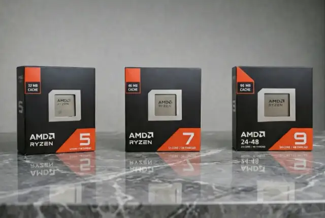 Trzy pudełka z procesorami nowe procesory AMD Ryzen 5, 7 i 9, z różną ilością pamięci cache i rdzeni.