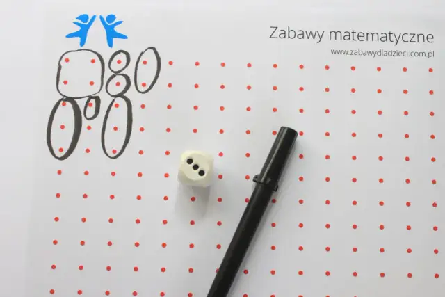 Zabawy matematyczne dla 6 latka: rysowanie cyfr i figur z kropek, kostka do gry i flamaster.