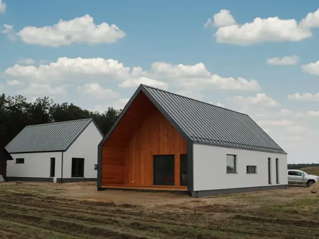 Dwa nowoczesne domy z szarym dachem i białymi ścianami, jeden z drewnianą elewacją.