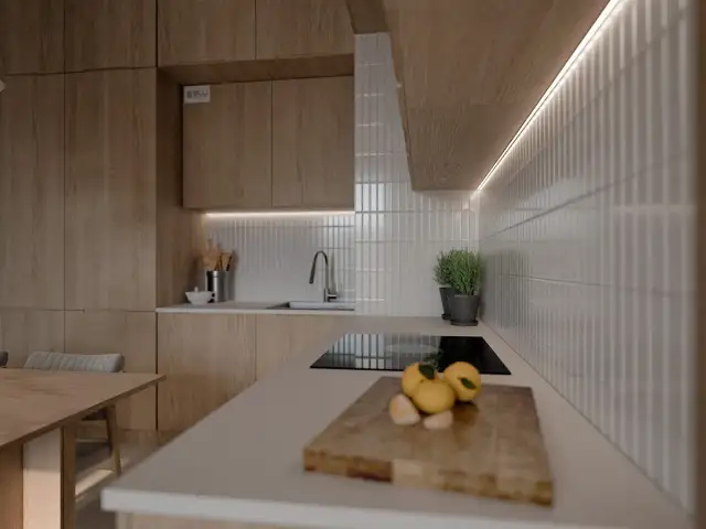 Białe, pionowe płytki między szafkami w kuchni, tworzące elegancką mozaikę.