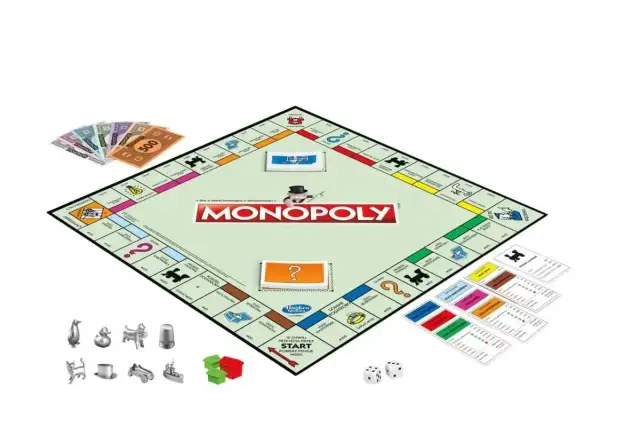 Plansza do gry Monopoly, banknoty, pionki, karty i kostki.