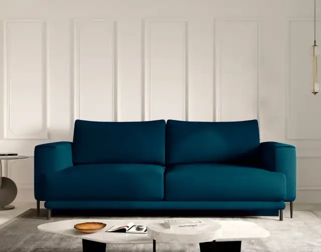Idealne kolory ścian do niebieskiej kanapy, które zachwycą każdego