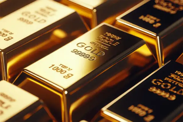 Sztabki czystego złota 999.9, błyszczące, z wygrawerowanymi oznaczeniami.