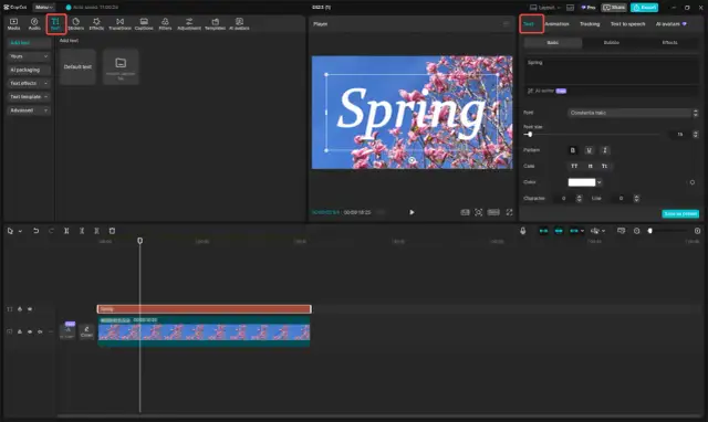 Edytor wideo z opcjami tekstu, gdzie słowo "Spring" jest wyświetlane na tle kwitnącej wiśni.