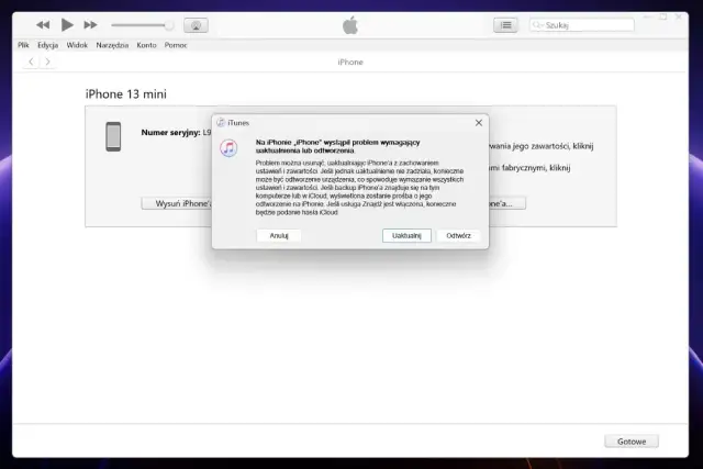 Komunikat w iTunes informuje o problemie z iPhone'em 13 mini, sugerując uaktualnienie lub odtworzenie, co może pomóc jak usunąć blokadę ekranu.