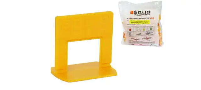 Żółty klips systemu poziomowania płytek SOLID. Opakowanie zawiera 100 sztuk klipsów o fugi 2mm.