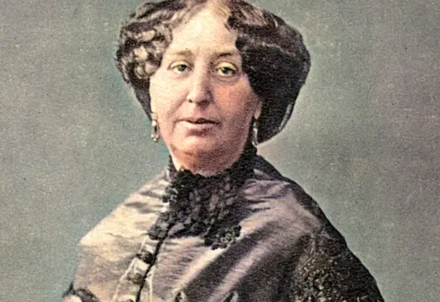 Portret George Sand, francuskiej pisarki, w eleganckiej sukni z koronkowym kołnierzem.