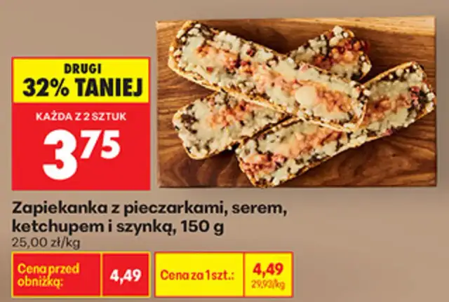 Zapiekanka z pieczarkami, serem i szynką na desce, z promocją 32% taniej.