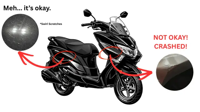 Czarny skuter z widocznymi uszkodzeniami. Sprawdzenie motocykla przed kupnem ujawnia drobne rysy i poważne pęknięcia po upadku.