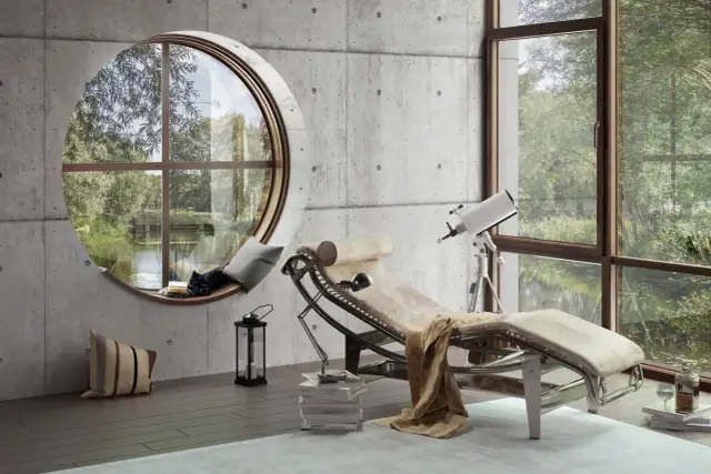 Nowoczesny salon z betonem i drewnem. Leżanka, teleskop i okrągłe okno z widokiem na zieleń.