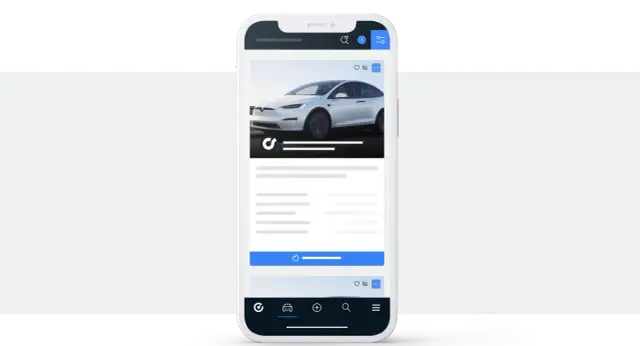 Aplikacja mobilna pokazująca białe auto. Tu handlarze kupują auta w Niemczech, szukając okazji.