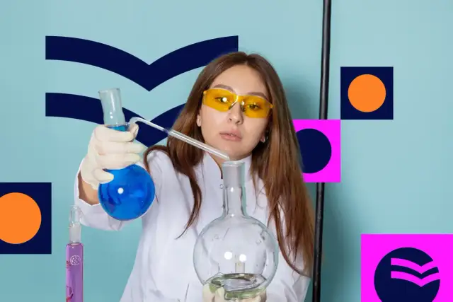 Kobieta w okularach ochronnych i białym fartuchu przeprowadza eksperyment z płynami w probówkach.