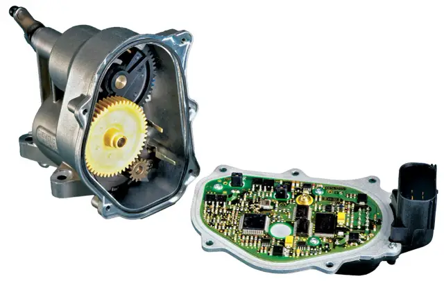 Rozłożony element elektroniczny przepustnicy samochodowej z widocznymi zębatkami i płytką drukowaną.