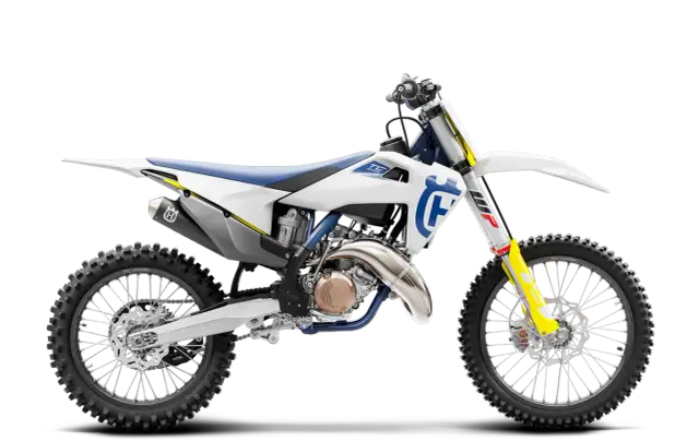 Motocykl Husqvarna TC 125 w białej i niebieskiej kolorystyce, widok z boku.