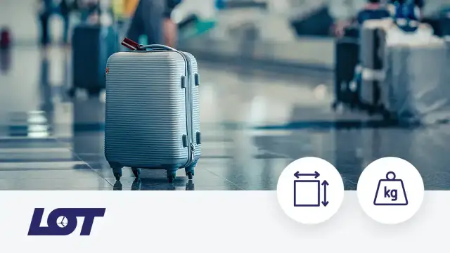 Szary walizka podręczna na lotnisku. Sprawdź, czy LOT waży bagaż podręczny, aby uniknąć niespodzianek.