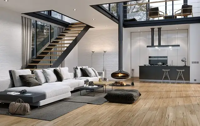 Nowoczesna antresola w domu z widokiem na schody, wiszący kominek i kuchnię.