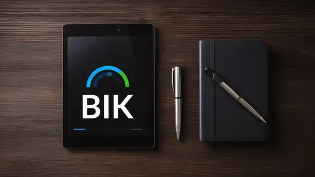 Tablet z logo BIK, długopis i czarny notatnik na drewnianym tle.