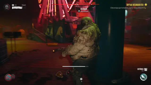 Potężny Oślizglak, jeden z przerażających postaci z Dead Island 2, czeka na swoją kolej na deptaku nieumarłych.