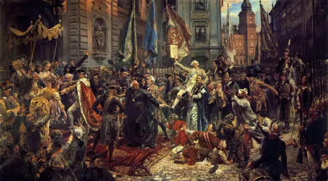 Uroczysta procesja z udziałem postaci historycznych, symbolizująca proces filomatów i filaretów. Tłum, sztandary i wojsko tworzą dynamiczną scenę.