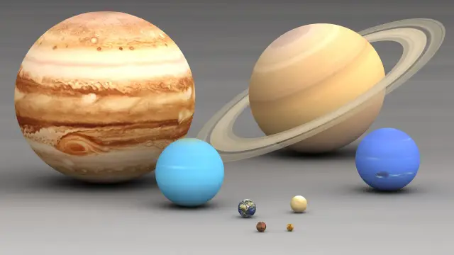 Porównanie planet Układu Słonecznego: Jowisz, Saturn z pierścieniami, Uran, Neptun, Ziemia i mniejsze planety. Widać, jak niewielka jest średnica Ziemi wobec gigantów.