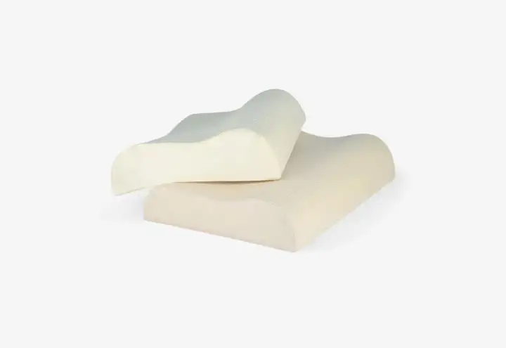 Two ergonomic pillows designed for neck pain relief. These almohadas para dolor de cuello offer contoured support for a comfortable sleep.