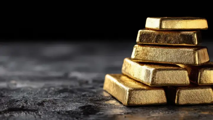 Una pila de lingotes de oro relucientes, tan valiosos que incluso el oro se raya.