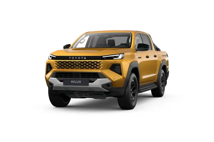 Złoty Toyota Hilux z czarnymi dodatkami i nowoczesnym grillem, gotowy na każdą przygodę.