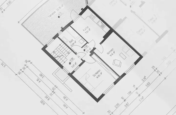 Plan domu z zaznaczonym metrażem pomieszczeń: kuchnia, łazienka, salon, sypialnia i taras. Wymiary podane w m².