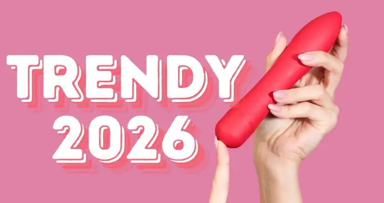 Trendy 2026: odkryj najlepsze gadżety erotyczne. Czerwony wibrator w dłoni na różowym tle.
