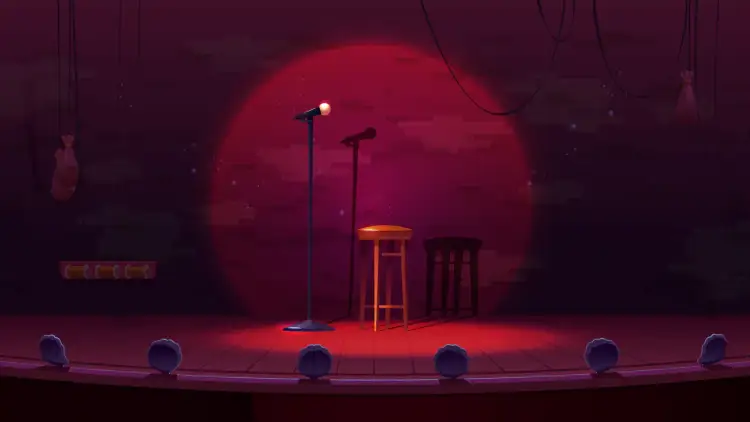 Scena klubu komediowego z mikrofonami i stołkami. Zastanawiasz się, ile zarabia stand-uper?