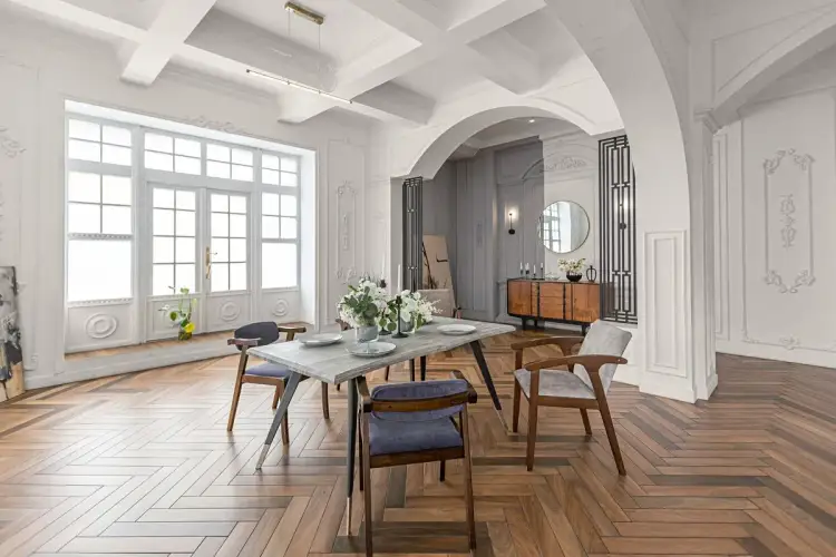 Elegancki salon z jadalnią, gdzie łuk stanowi centralny punkt. Aranżacja wnętrza pokazuje, jak wykończyć łuk w salonie, tworząc stylowe przejście.