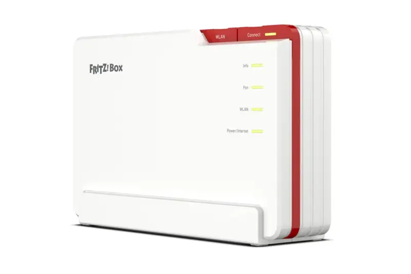 Biały router FRITZ!Box z czerwonymi akcentami, z zapalonymi diodami sygnalizującymi status, w tym qos.