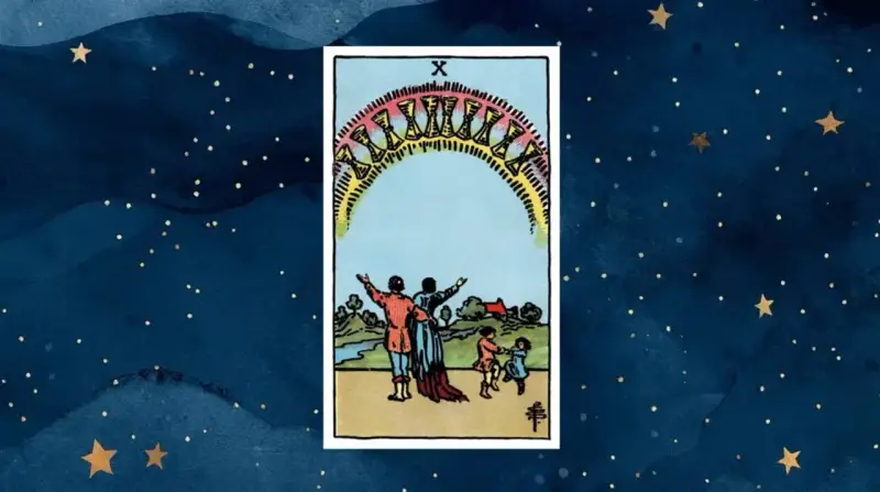 10 pucharów tarot: rodzina świętuje pod tęczowym łukiem pełnym pucharów, symbolizując spełnienie i szczęście.