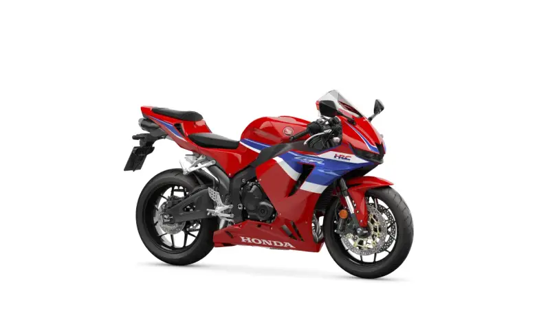 Czerwony motocykl sportowy Honda CBR 600 z niebieskimi i białymi pasami. Poznaj honda cbr 600 dane techniczne.