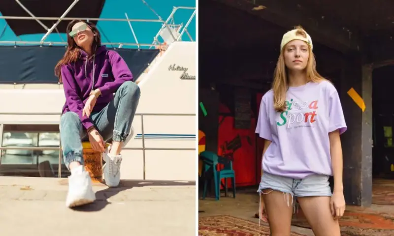 Dwie kobiety w modnych stylizacjach streetwear. Jedna w fioletowej bluzie i jeansach, druga w liliowej koszulce z napisem "Pizza Sport". Polskie marki odzieżowe streetwear w akcji.