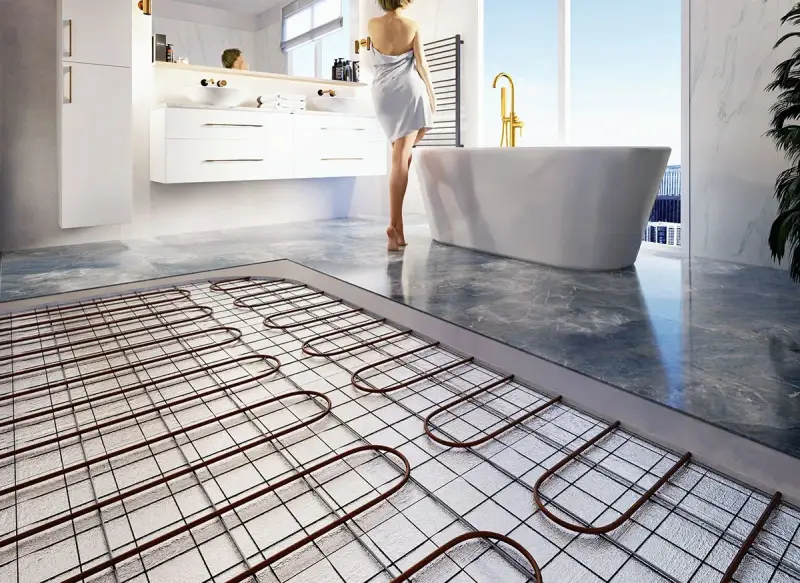 Instalacja ogrzewania podłogowego, przygotowanie pod różne rodzaje wylewek. Łazienka z wanną i umywalkami.