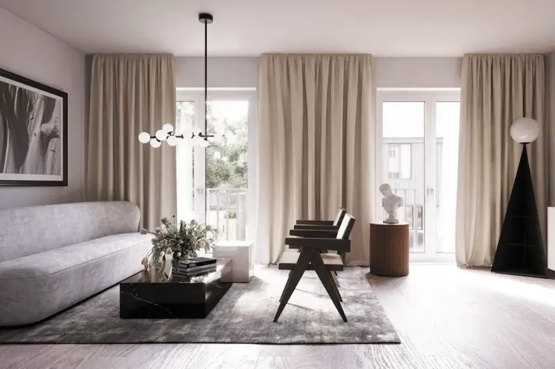 Ett modernt vardagsrum med en elegant soffa, mörkt marmorbord och en unik golvlampa. Blå inredning i vardagsrummet skapar en lugn atmosfär.