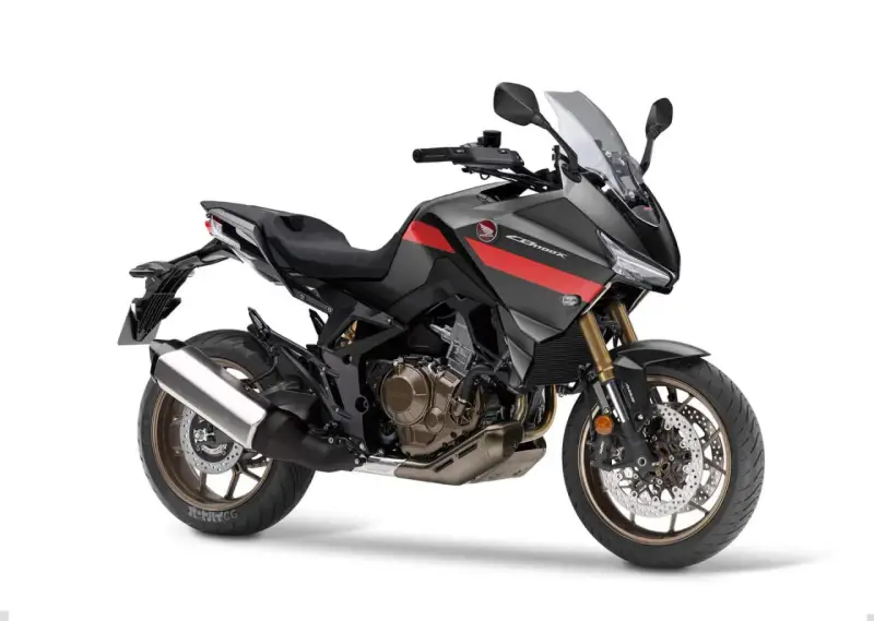 Nowoczesny motocykl Honda NT 1100 w kolorze grafitowym z czerwonymi akcentami, gotowy na dalekie podróże.