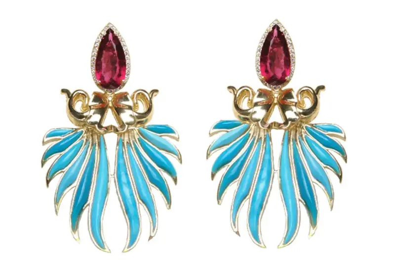Exquisite gold earrings featuring a teardrop ruby and vibrant blue enamel, reminiscent of the rich colors found in brazilian stones.