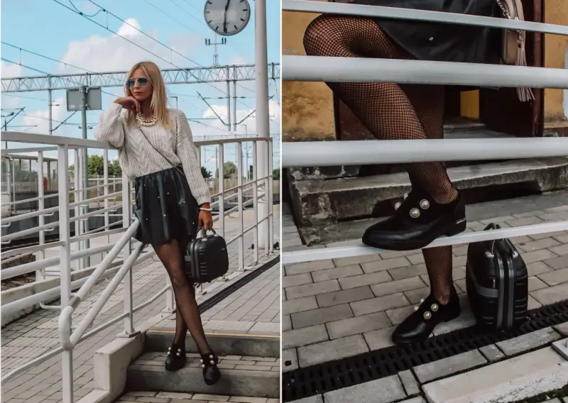 Stylizacja z czarną spódniczką i swetrem. Czy mokasyny pasują do sukienki? Tak, te ozdobione perłami świetnie uzupełniają look.