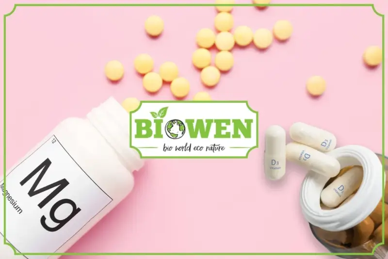 Biała butelka z magnezem, kapsułki z witaminą D3 i żółte tabletki. Logo "Biowen" sugeruje naturalne suplementy, być może zawierające kwas orotowy.