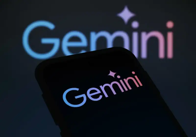 Logo Gemini na ekranie telefonu i w tle. Zastanawiasz się, gemini co to jest? To platforma do handlu kryptowalutami.
